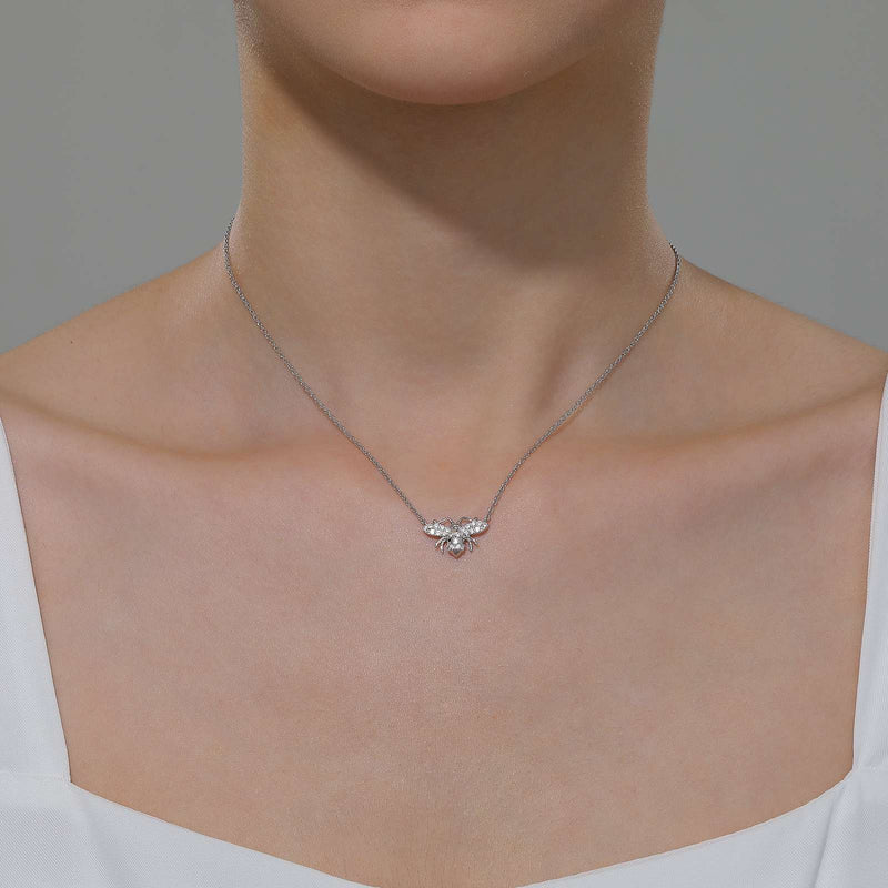 Fun and sweet. Wear on its own or add to your favorite layer of necklaces. This adjustable busy bee necklace features Lafonn's signature simulated diamonds in sterling silver bonded with platinum. Bee is a symbol of hard work, commitment, and resilience.  CTW: 0.49 SKU: N0253CLP20 STONE COUNT: 25 CENTER STONE: N/A DIMENSION: Approx. 16.7 mm (W) x 10.3 mm (H) LENGTH: Approximate length: 20 inches