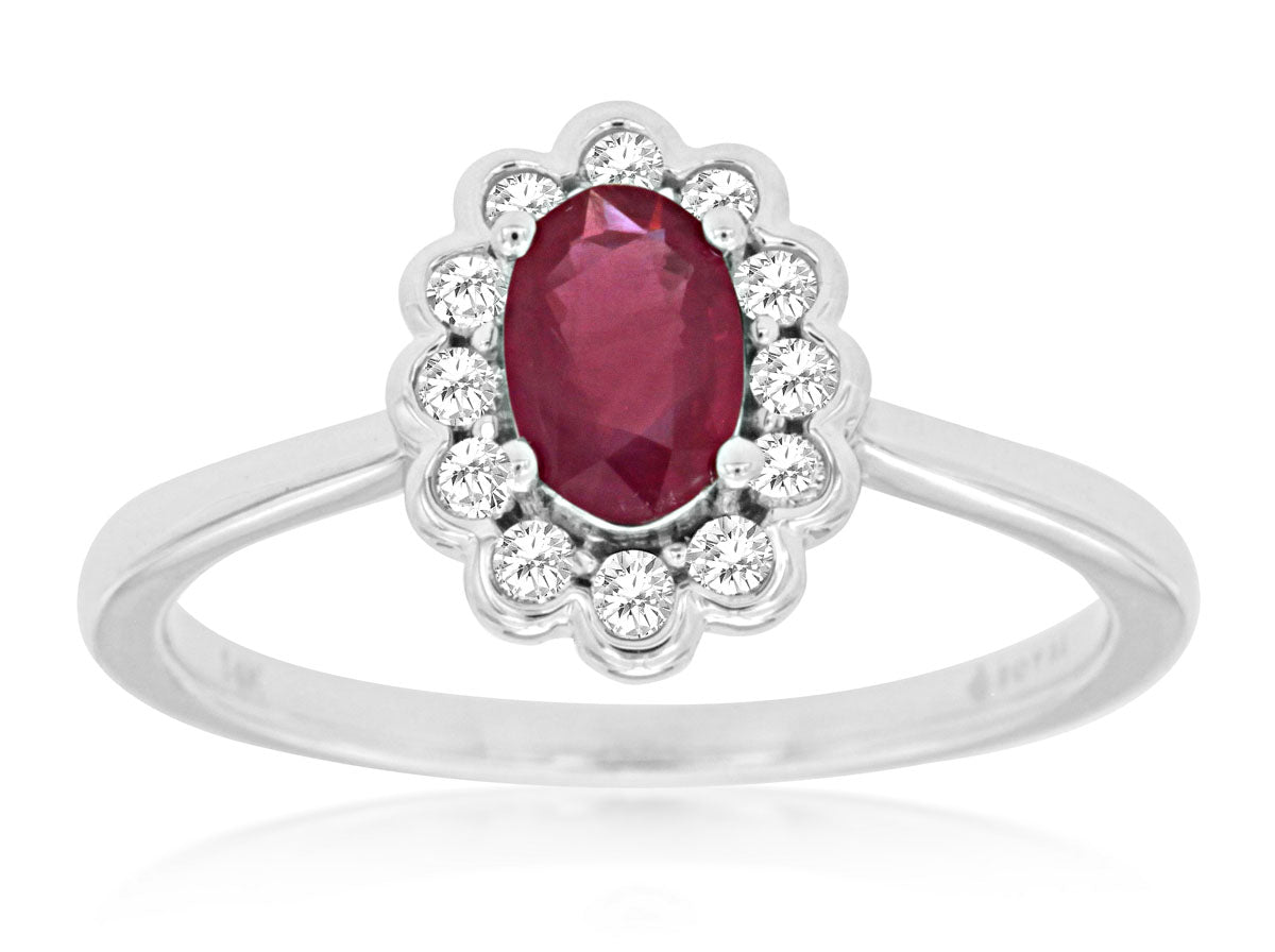 14K white gold ring adorned with a vibrant .55ct Ruby and accentuated by .16cts of sparkling diamonds. This exquisite piece combines the fiery allure of the Ruby with the captivating brilliance of diamonds. Size 7