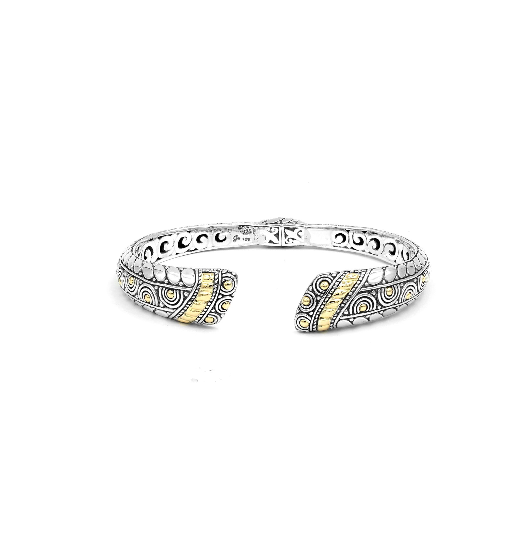 Samuel B. Sterling Silver and 18K Yellow Gold Sholeh Bangle. Our Sterling Silver and 18k solid Gold hinged bangle with scrollwork is handcrafted in Bali by our skilled artisans. From our Bali Privé™ collection which embodies the 2021 PANTONE™ Colors of the Year, showcasing the perfect combination of sterling silver and solid 18k gold.