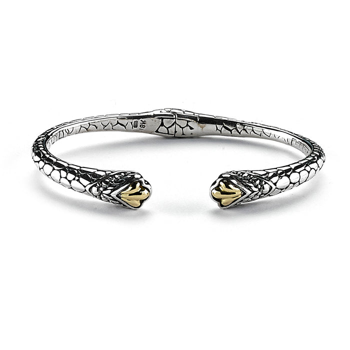 Samuel B. Sterling Silver and 18K Yellow Gold Pebble Design Hinged Xena Bangle.  Our Sterling Silver 18k solid Gold pebble design hinged cable bangle, handcrafted in Bali by our skilled artisans. From our Bali Privé™ collection which embodies the 2021 PANTONE™ Colors of the Year, showcasing the perfect combination of sterling silver and solid 18k gold.