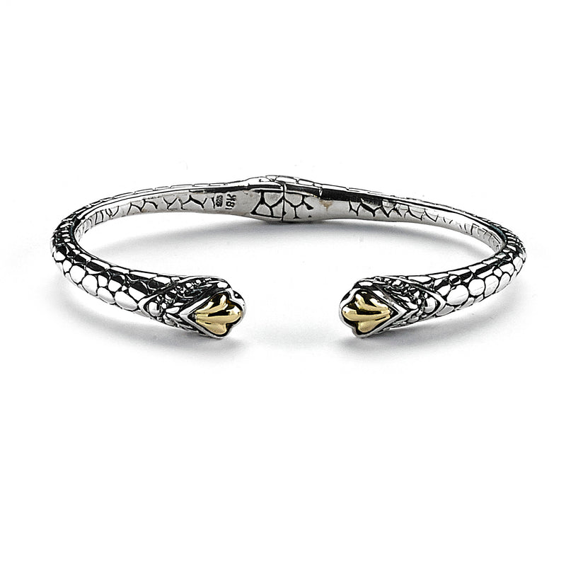 Samuel B. Sterling Silver and 18K Yellow Gold Pebble Design Hinged Xena Bangle.  Our Sterling Silver 18k solid Gold pebble design hinged cable bangle, handcrafted in Bali by our skilled artisans. From our Bali Privé™ collection which embodies the 2021 PANTONE™ Colors of the Year, showcasing the perfect combination of sterling silver and solid 18k gold.