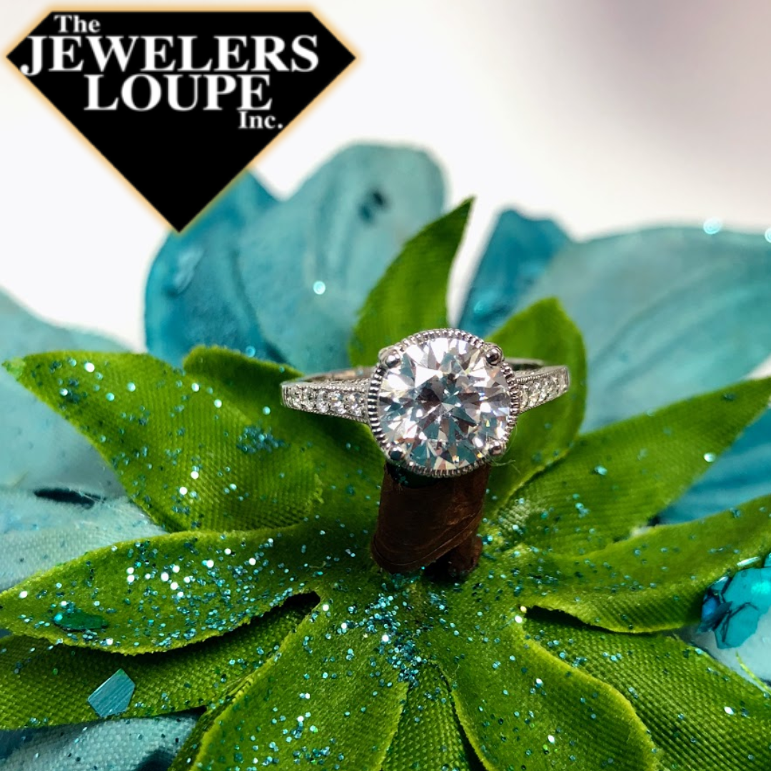 Sterling Silver Ring set with White Cubic Zirconia in the Center of Ring and on the shank of the Ring