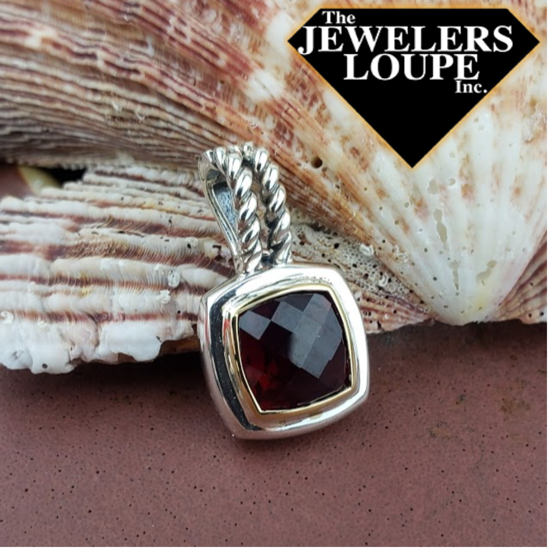 Jeanex Sterling Silver and 18K Yellow Gold 5.90ctw Cushion Cut Simulated Garnet Pendant with Double Cable Design Bail.