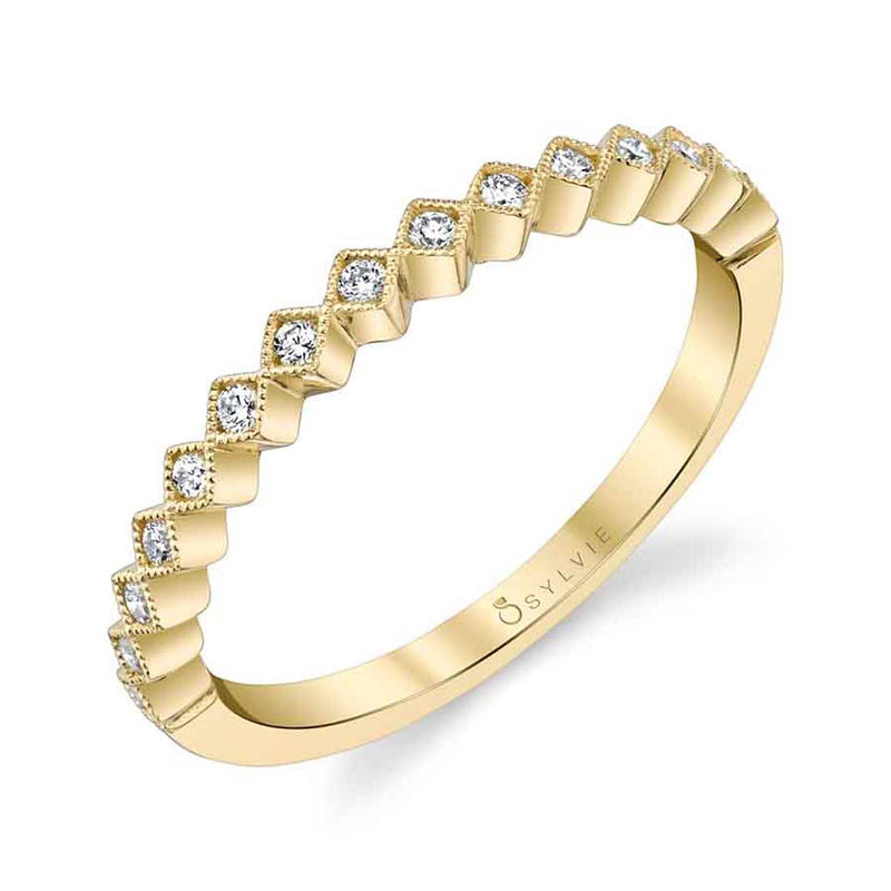 This modern diamond stackable band features 0.13 carats of shimmering diamonds in diamond shapes all around. Available in white, yellow and rose gold this fun stackable band pairs perfectly with any modern engagement ring or wedding set.