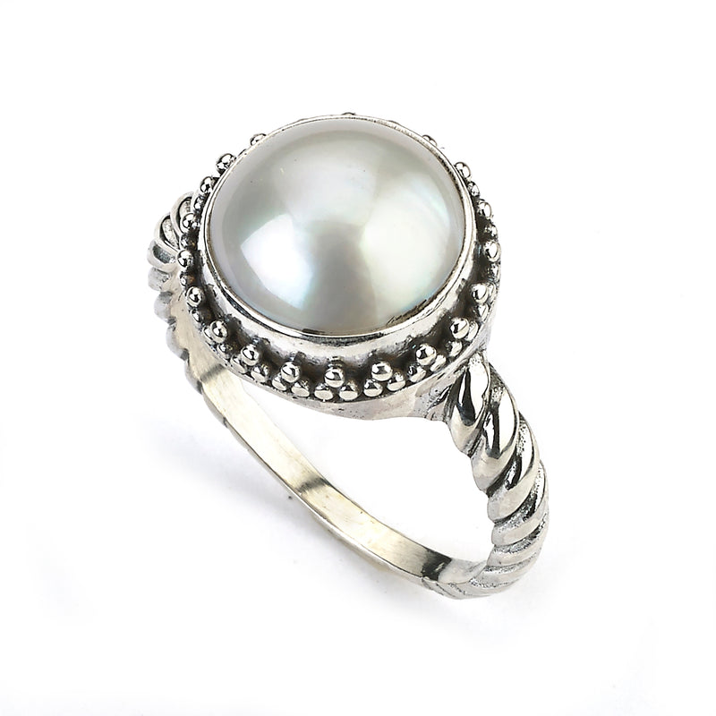 Samuel B. Sterling Silver and White Mabe Pearl Batur Ring with cable style shank, Size 7.5. Our Sterling Silver white mabe pearl ring with twisted shank, handcrafted in Bali by our skilled artisans. The Gems of the Sea collection is inspired by the beauty of the white beaches, sparkling sea and the flourishing coral reefs of Bali.