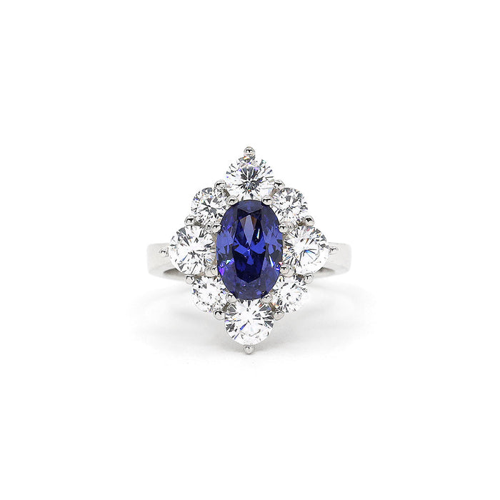 From the Victoria Collection by Anna Zuckerman, Elegant 1.5 carat sapphire blue crystalline oval in a halo of round diamond white round crystalline 5 tcw set in platinum plated sterling silver 925