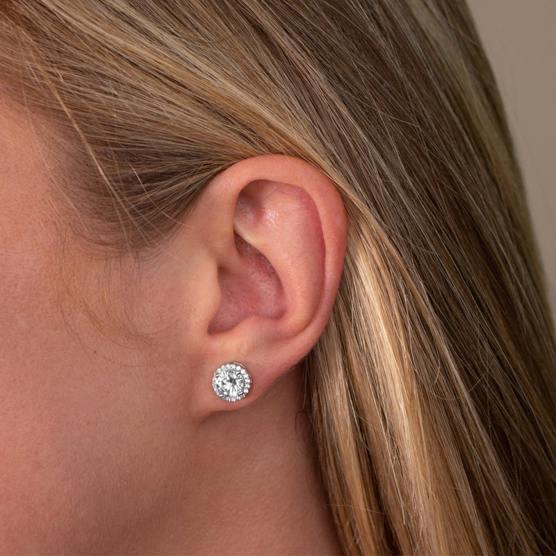 From the Anastasia Collection by Anna Zuckerman Luxury, Sterling Silver CZ Halo Stud Earrings.