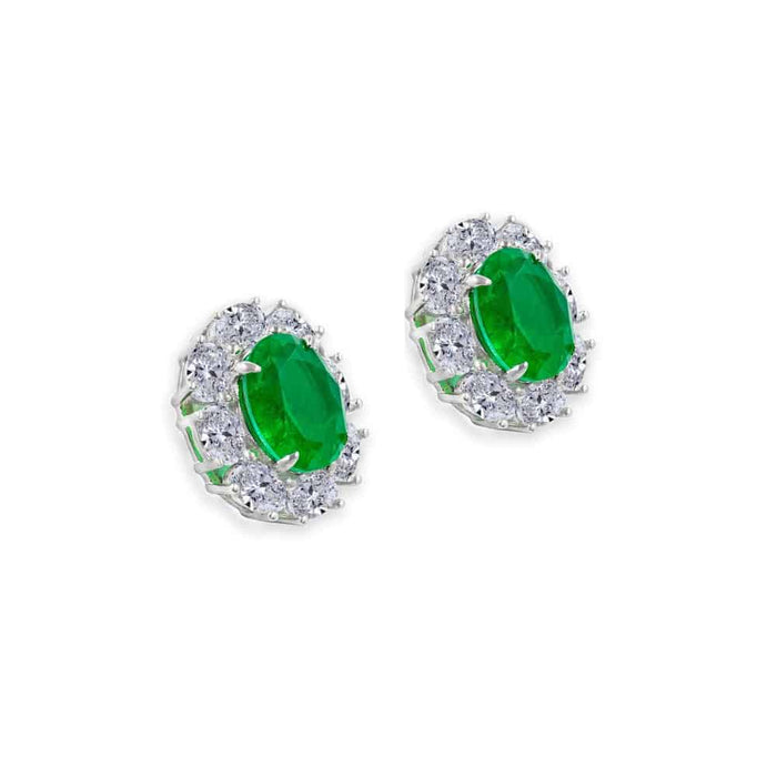 From the Victoria Collection by Anna Zuckerman Luxury, Sterling Silver Oval Emerald Green CZ Halo Stud Earrings.  Classic 2 carat oval emerald green or sapphire blue crystalline stud with diamond white crystalline halo 8 tcw set in platinum plated sterling silver 925.