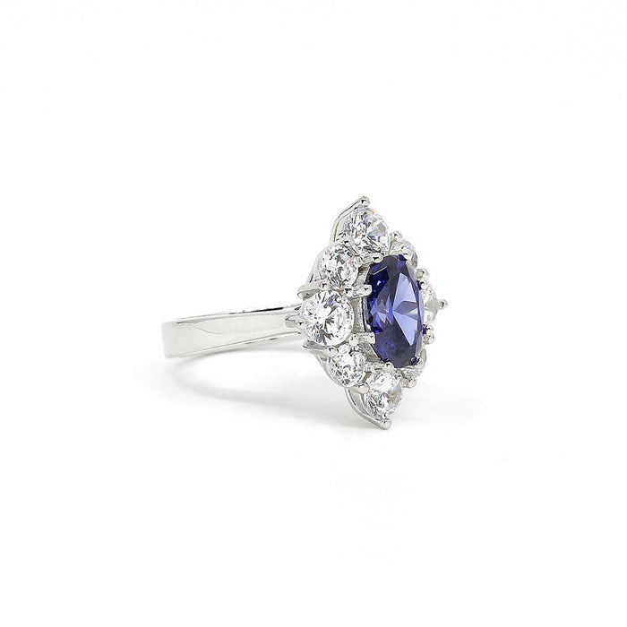 From the Victoria Collection by Anna Zuckerman, Elegant 1.5 carat sapphire blue crystalline oval in a halo of round diamond white round crystalline 5 tcw set in platinum plated sterling silver 925