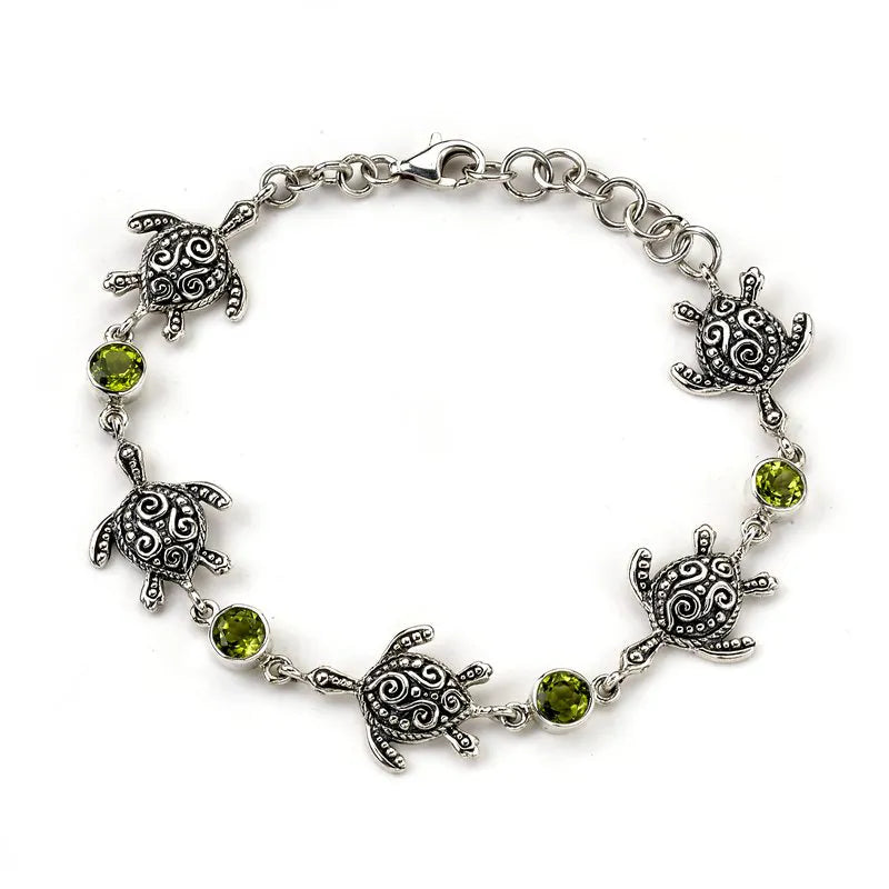 Samuel B. sterling silver turtle bracelet with round peridot stones