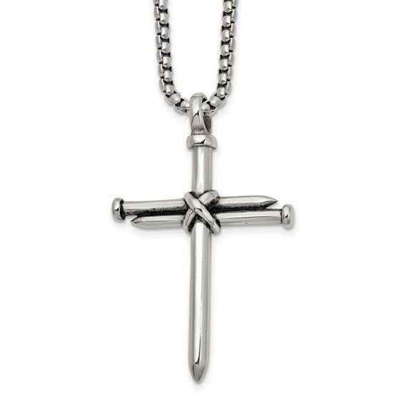 Fashioned from stainless steel, this Chisel pendant features a captivating blend of antiqued and polished finishes, depicting a cross of nails, suspended gracefully from a 22-inch box chain necklace.