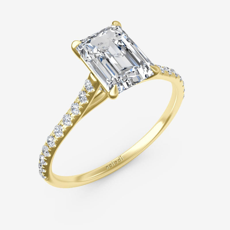 14K yellow gold cathedral semi mount ring for emerald cut diamond. Classic engagement setting with center stone sold separately. Perfect for custom rings