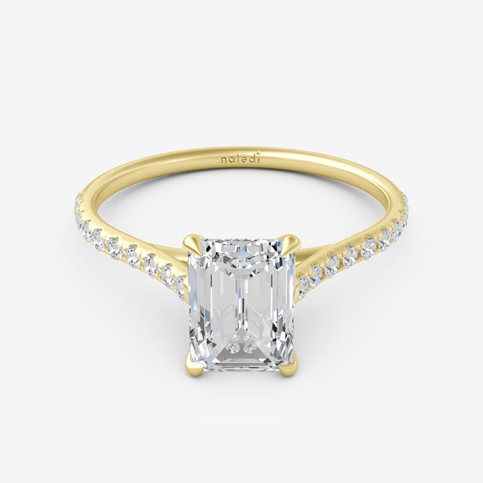 14K yellow gold cathedral semi mount ring for emerald cut diamond. Classic engagement setting with center stone sold separately. Perfect for custom rings