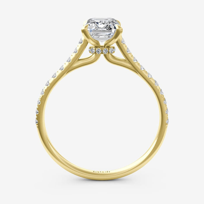 Gold ring with a diamond on a white background