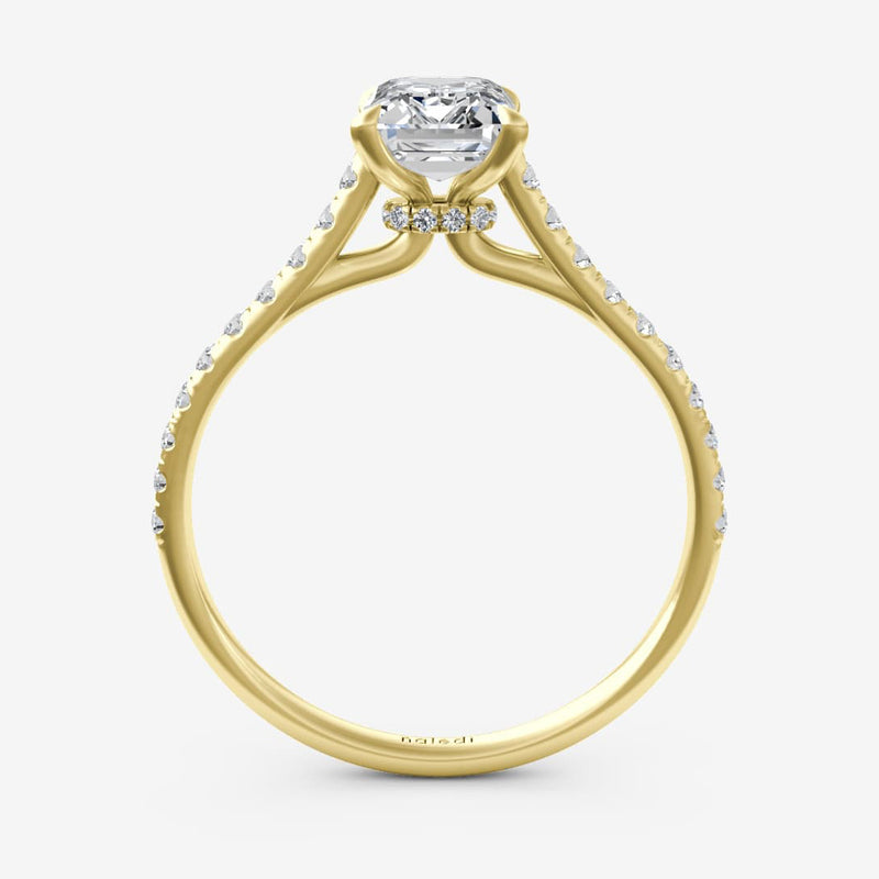 Gold ring with a diamond on a white background