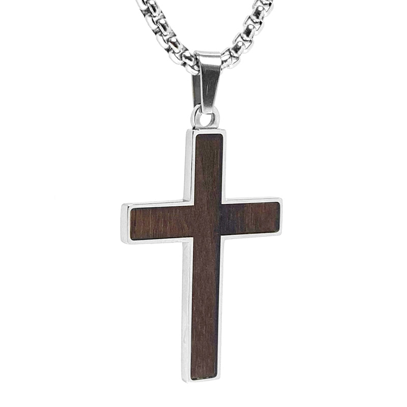 WALNUT WOOD CROSS II This unconventional and unique walnut wood necklace is perfect for anyone who wants a more natural look. Walnut Wood is set in stainless steel and features unique patterns and color variations. Cross can be reversed for a traditional look.