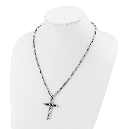 Fashioned from stainless steel, this Chisel pendant features a captivating blend of antiqued and polished finishes, depicting a cross of nails, suspended gracefully from a 22-inch box chain necklace.