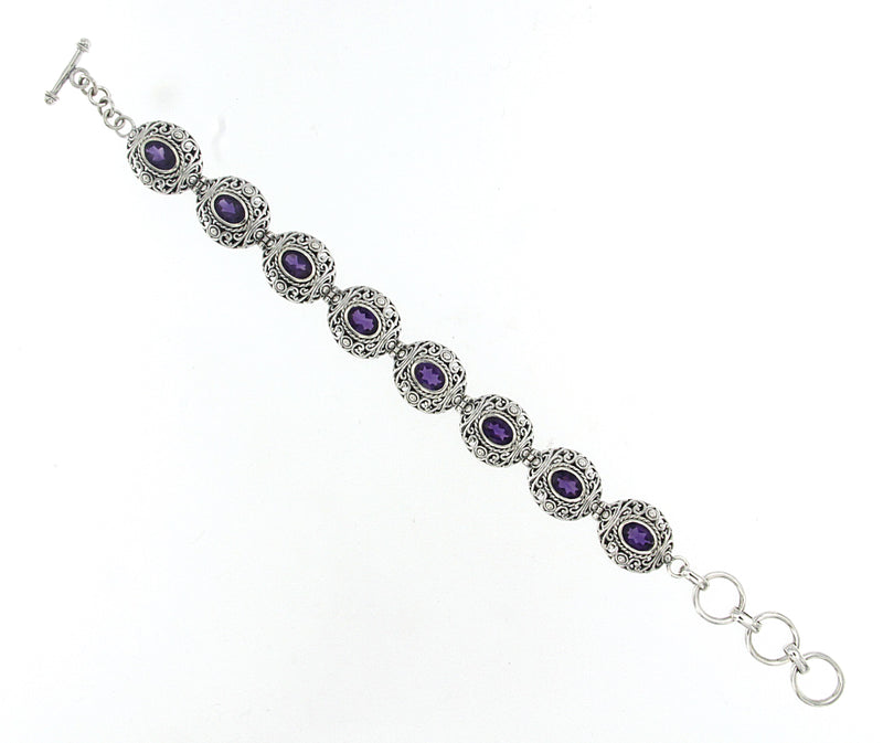 Samuel B. Sterling Silver Balinese Design Amethyst Bracelet, 6.5" with 1" extender. Our Sterling Silver amethyst station bracelet, handcrafted in Bali by our skilled artisans. From our signature collection, Royal Bali™ featuring designs handcrafted using sterling silver  and genuine gemstones. The February birthstone, Amethyst, is said to strengthen relationships and give its wearer courage. At one time, only royalty could wear the gem.
