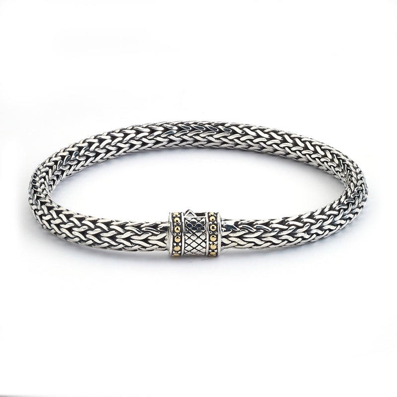 Samuel B. Sterling Silver and 18K Yellow Gold Bamboo Palm Bracelet, 7" Our criss cross tulang naga bracelet, handcrafted in Bali by our skilled artisans. Each creation in the Imperial Bali™ Collections draws its power from mystic dragons, yet bows in reverence to nature and ancient Balinese patterns, weaves and textures.