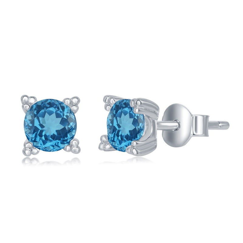 Sterling Silver Open Four Prong 5mm Round Blue Topaz Stud Earrings.