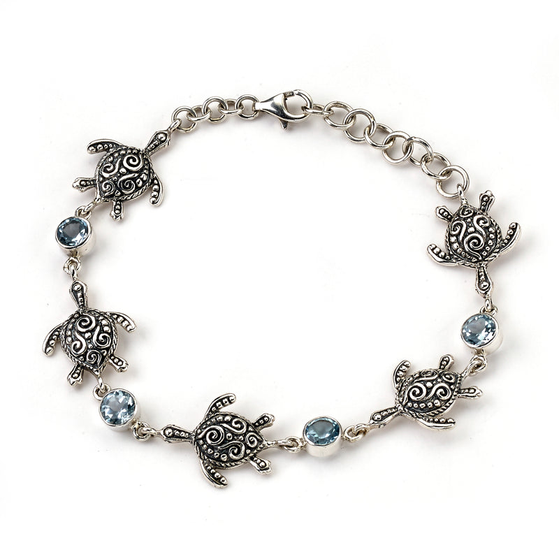 Samuel B. Sterling Silver Balinese Design Turtle and Blue Topaz Station Bracelet, 6.5" with 1" extender. Our Sterling Silver turtle & round blue topaz station bracelet, handcrafted in Bali by our skilled artisans. From our signature collection, Royal Bali™ featuring designs handcrafted using sterling silver and genuine gemstones.