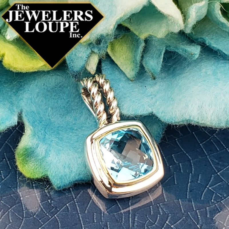 Jeanex Sterling Silver and 18K Yellow Gold 5.90ctw Genuine Cushion Cut Blue Topaz Pendant with Double Cable Design Bail.