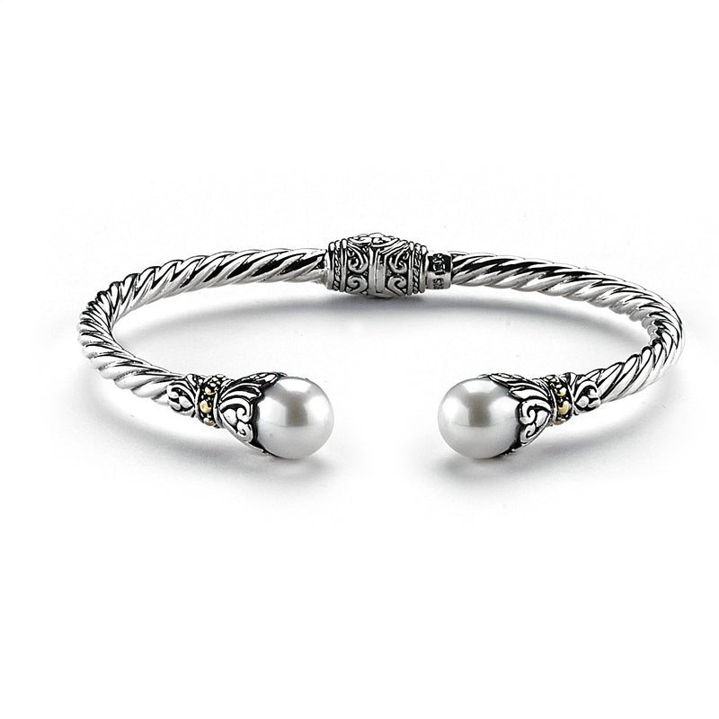 Samuel B. Sterling Silver and 18K Yellow Gold Cable Style Fresh Water Bangle. Our Sterling Silver 18k solid Gold 3mm twisted cable bangle with pearl endcaps, handcrafted in Bali by our skilled artisans. The Gems of the Sea collection is inspired by the beauty of the white beaches, sparkling sea and the flourishing coral reefs of Bali.
