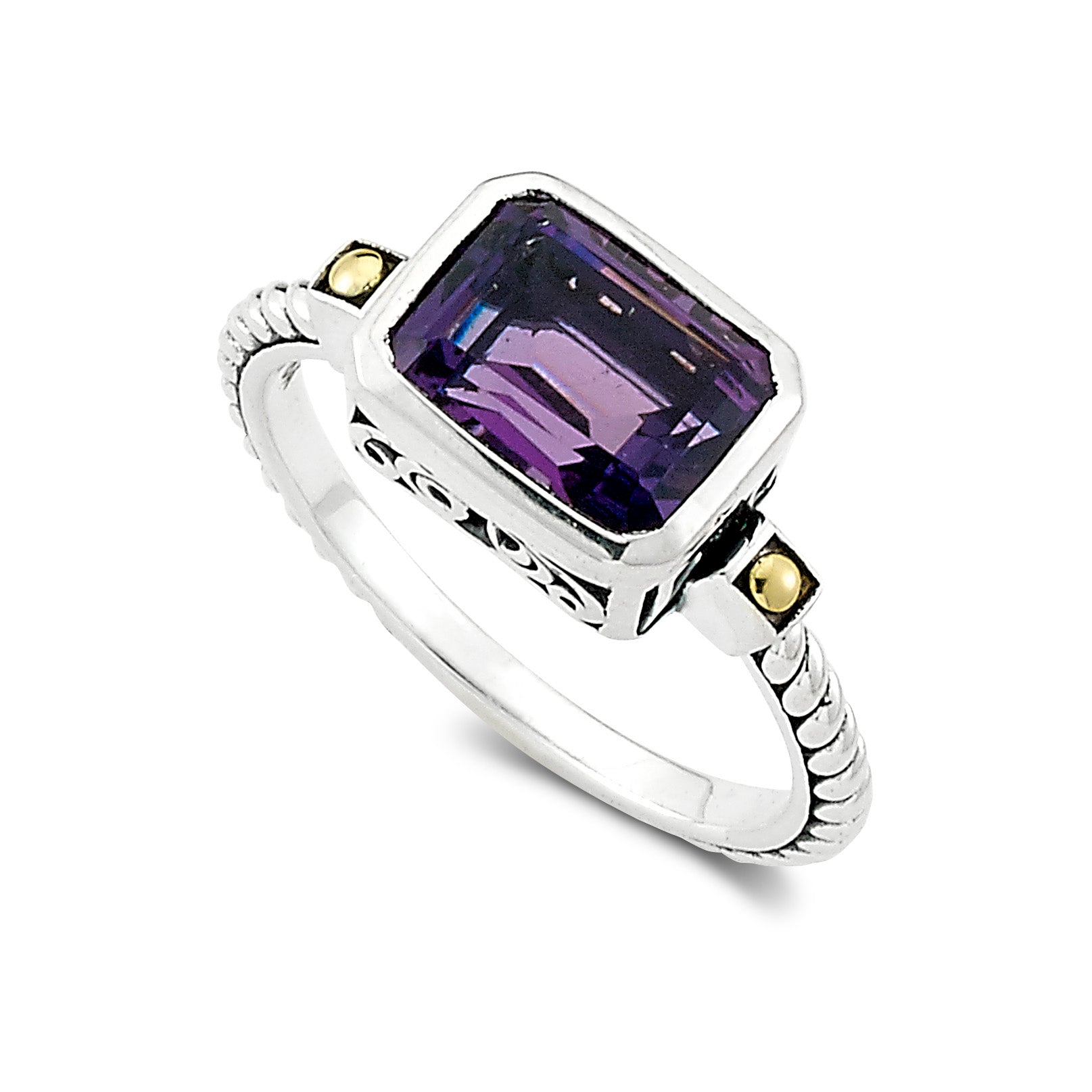 Samuel B Eirini Emerald Cut Amethyst Ring, Size 7. Our Sterling Silver and 18k yellow gold ring with emerald cut amethyst is handcrafted in Bali by our skilled artisans. From our signature collection, Royal Bali™ featuring designs handcrafted using sterling silver, solid 18k gold accents and genuine gemstones.