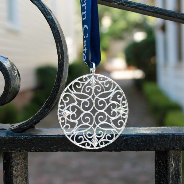 Southern Gates® 2022 Holiday Classic Scroll Ornament  Holiday Series  Filigree Classic Scroll Ornament A holiday collectable inspired by 18th and 19th century wrought iron gates throughout the South.  Sterling silver plated Includes collectors box and signature Southern Gates blue ribbon. Ornament size: 60mm