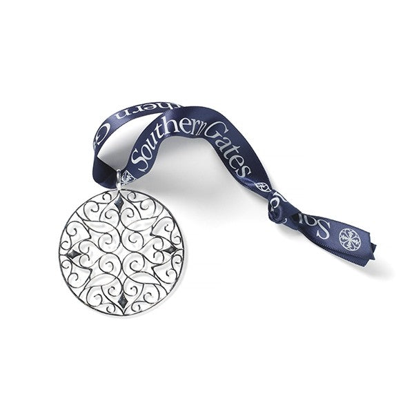 Southern Gates® 2022 Holiday Classic Scroll Ornament  Holiday Series  Filigree Classic Scroll Ornament A holiday collectable inspired by 18th and 19th century wrought iron gates throughout the South.  Sterling silver plated Includes collectors box and signature Southern Gates blue ribbon. Ornament size: 60mm