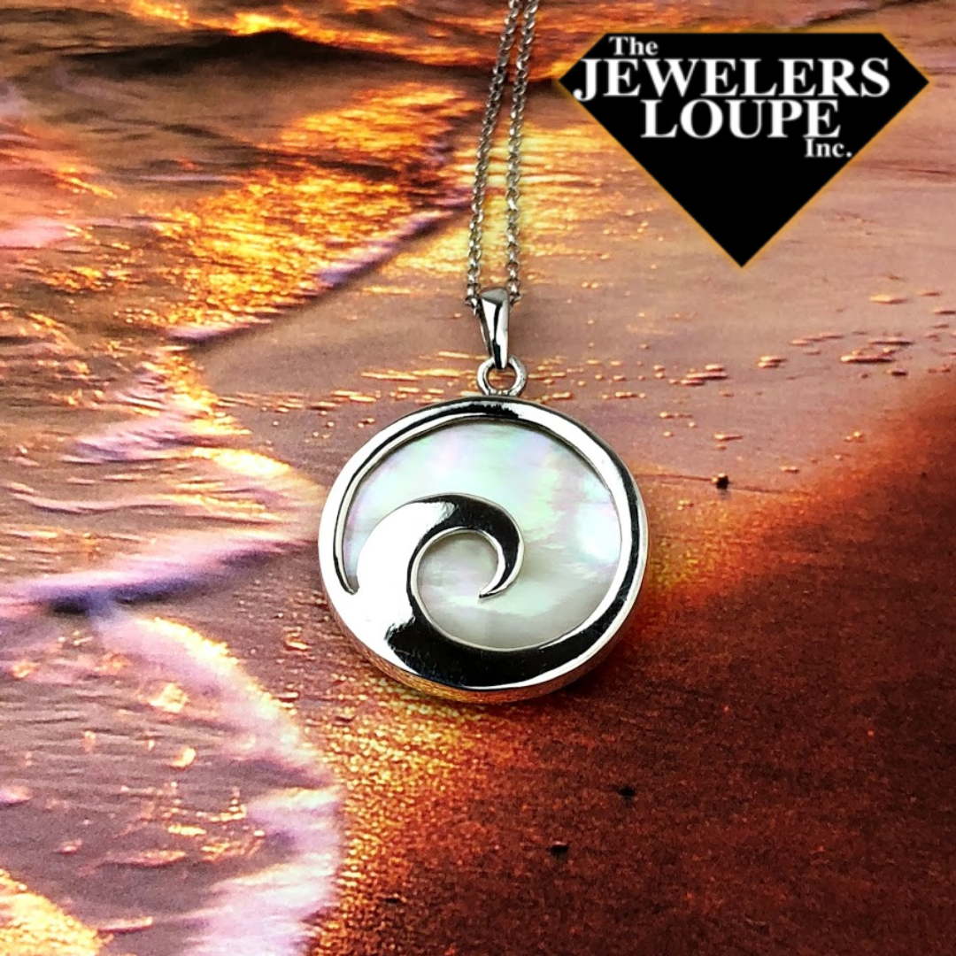 Sterling Silver Wave Design Round Mother of Pearl Reversible Necklace on 18" Sterling Silver Chain.