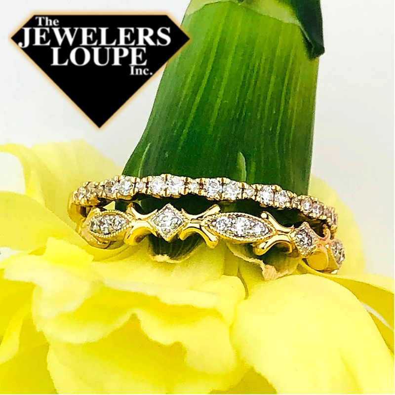 This delicate 14K Yellow Gold stackable ring features .18ctw graduated round diamonds in a repeating scalloped pattern.