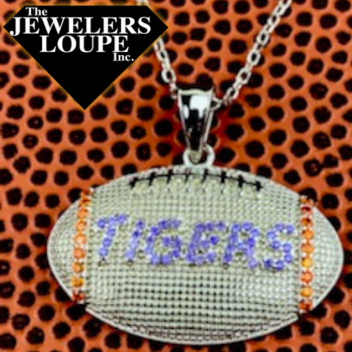 Sterling Silver Football Charm with "Tigers" in Purple colored cubic zirconia with Orange Cubic Zirconia accents on an 18" Sterling Silver chain. (Tigers charms slightly larger than Paw charm)