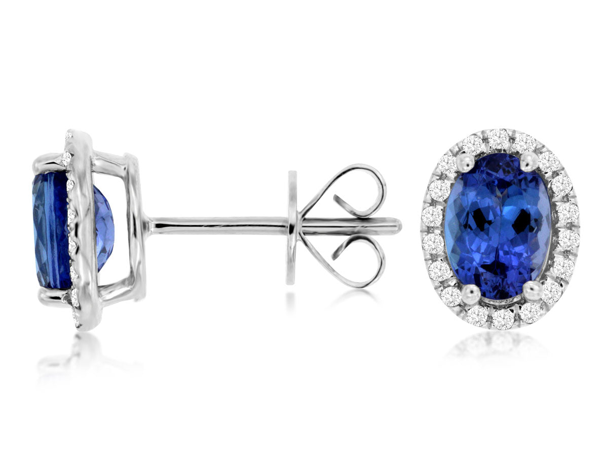 14K White Gold Stud Halo Earrings set with 1.68ctw Oval Genuine Tanzanite surrounded by .19ctw Diamond.  *color of stones may vary from picture