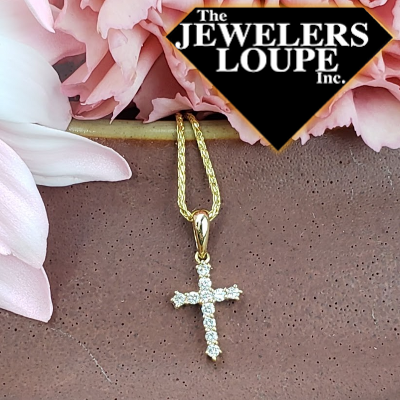 Tiny Cross with .10ctw Diamonds set in 14K Yellow Gold. Cross measures 5/8".  *Chain sold separately.